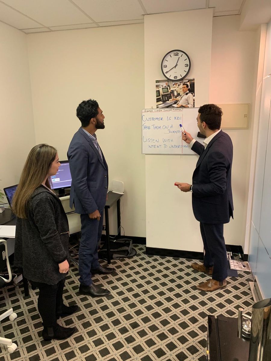 The Maple team planning at the whiteboard